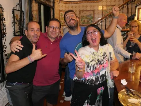 Local guide leading a small group through Seville streets